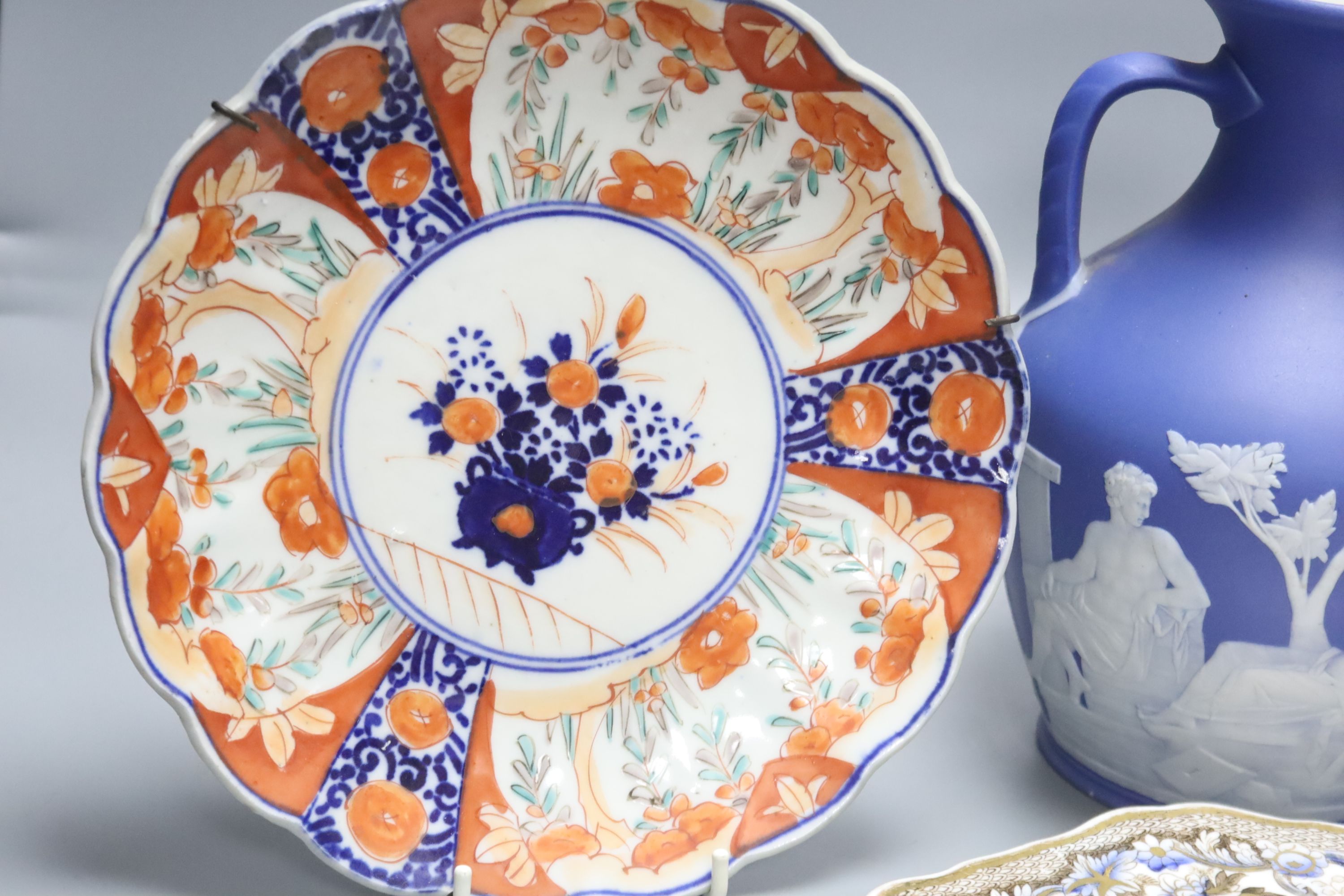 A Wedgwood jasperware Portland vase, 19th century, height 21cm, and four Victorian plates to include Spode and Royal Crown Derby